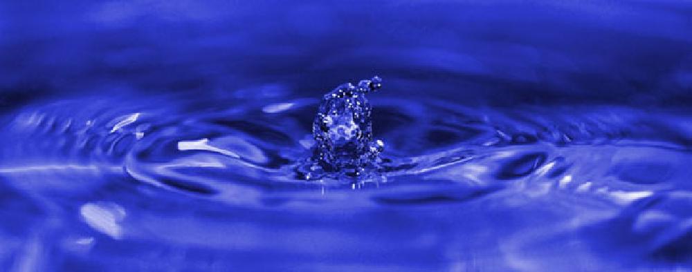 Drop of water on blue