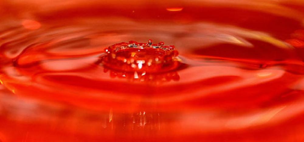Drop of water on red